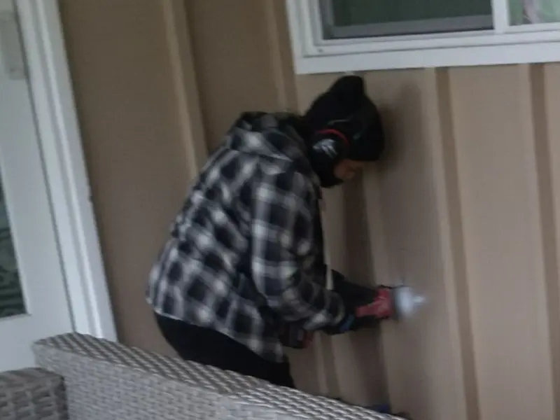 Professional electrician installing an exterior outlet in Oregon